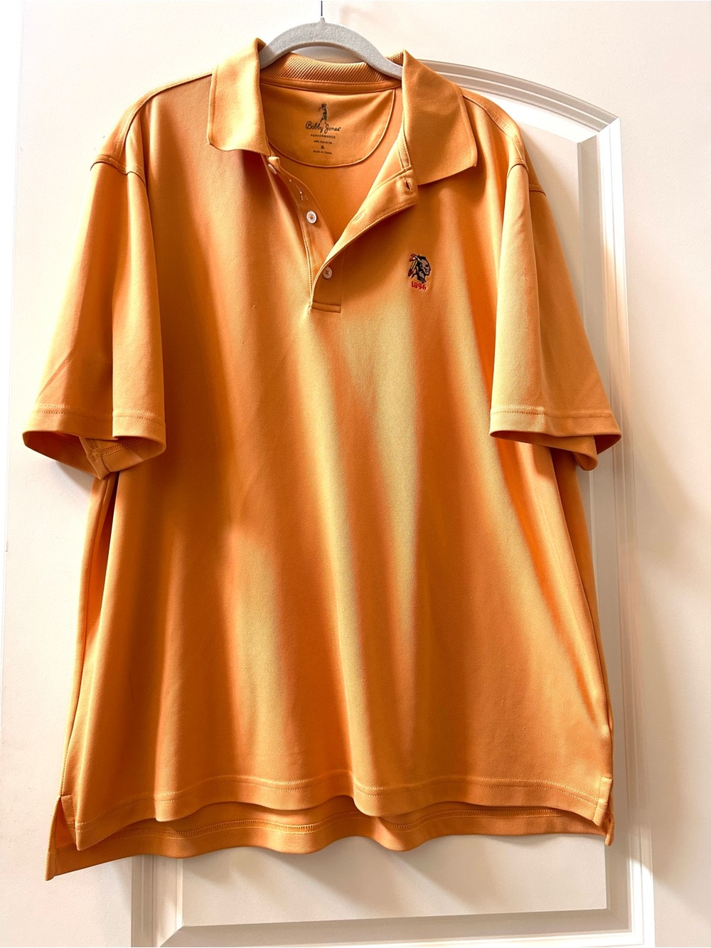 VTG Bobby Jones Aronimink Golf Club Sherbet Orange Performance Polo. Native icon